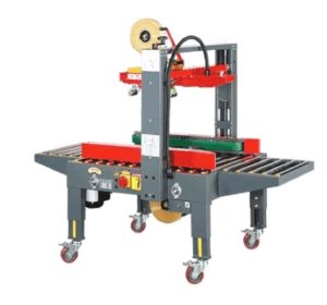 Tapping machine for cardboard boxes